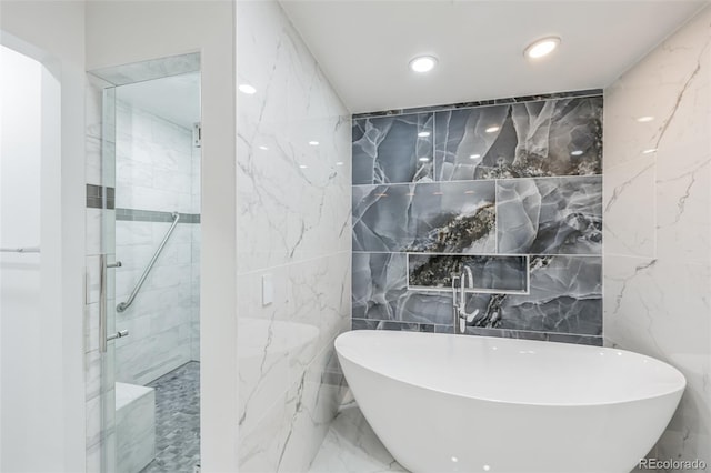 bathroom featuring tile walls, tile patterned flooring, and shower with separate bathtub