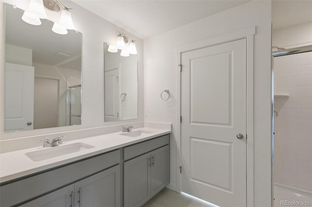 6721 Raven Ridge Ter, Colorado Springs, CO 80925 - bathroom with a shower with door, double vanity, and tile patterned flooring