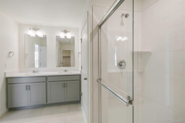 6721 Raven Ridge Ter, Colorado Springs, CO 80925 - full bathroom with a stall shower, double vanity, and tile patterned floors
