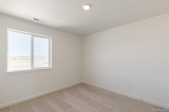 6721 Raven Ridge Ter, Colorado Springs, CO 80925 - empty room with light carpet and baseboards