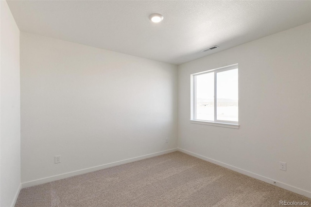 6721 Raven Ridge Ter, Colorado Springs, CO 80925 - empty room featuring light colored carpet and baseboards