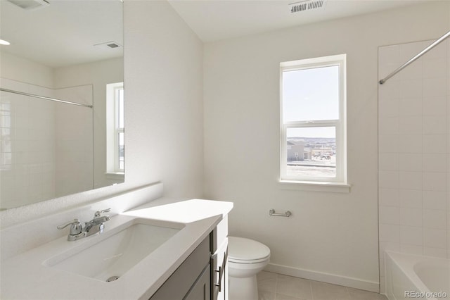 6721 Raven Ridge Ter, Colorado Springs, CO 80925 - bathroom featuring tile patterned flooring, toilet, vanity, baseboards, and tub / shower combination
