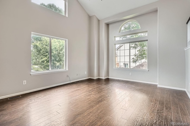 11029 Grouse Ct, Parker, CO 80134 - spare room with high vaulted ceiling and dark wood-type flooring