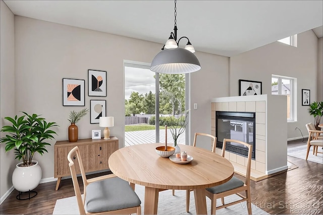 11029 Grouse Ct, Parker, CO 80134 - dining area with dark wood-style flooring and a fireplace