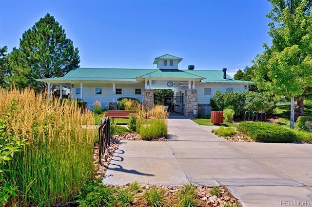 11029 Grouse Ct, Parker, CO 80134 - view of front of house with stone siding and a metal roof