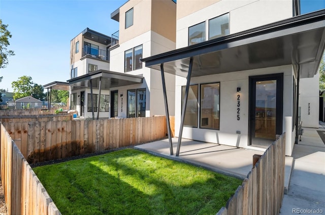 2323 S High St, Denver, CO 80210 - rear view of house featuring stucco siding