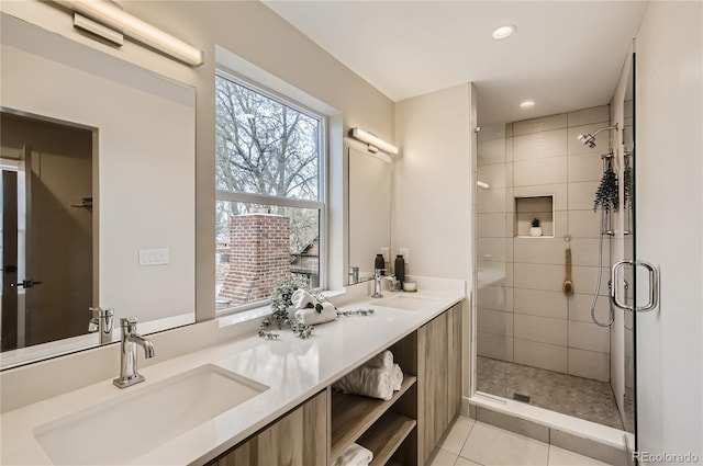 2323 S High St, Denver, CO 80210 - full bathroom featuring a shower stall, double vanity, healthy amount of natural light, recessed lighting, and tile patterned floors