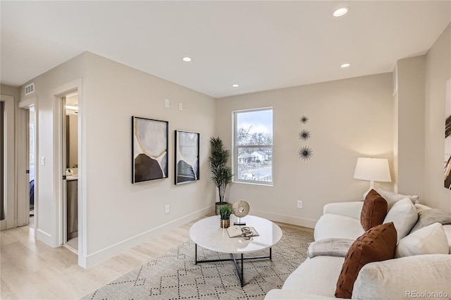 2323 S High St, Denver, CO 80210 - living area with light wood-style floors and recessed lighting