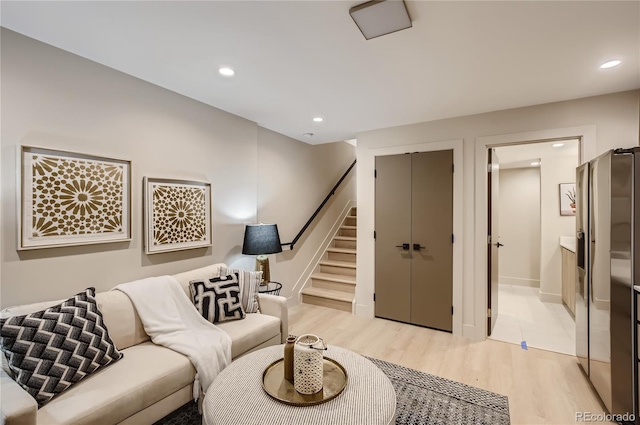 2323 S High St, Denver, CO 80210 - living area with light wood-style floors, stairway, and recessed lighting