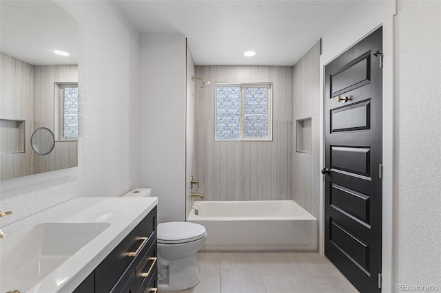 18396 E Mexico Pl, Aurora, CO 80017 - full bath featuring toilet, vanity, plenty of natural light, tile patterned flooring, and a textured ceiling
