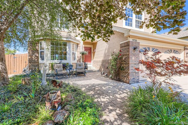 9733 Quay Loop, Broomfield, CO 80021 - view of patio with an attached garage