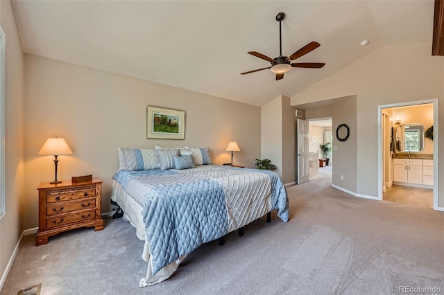 9733 Quay Loop, Broomfield, CO 80021 - bedroom featuring light carpet, vaulted ceiling, ensuite bath, and a ceiling fan