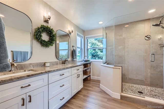 9733 Quay Loop, Broomfield, CO 80021 - full bath with a stall shower, double vanity, wood finished floors, and recessed lighting