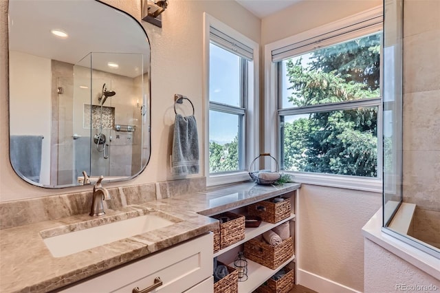 9733 Quay Loop, Broomfield, CO 80021 - full bathroom featuring vanity and a tile shower