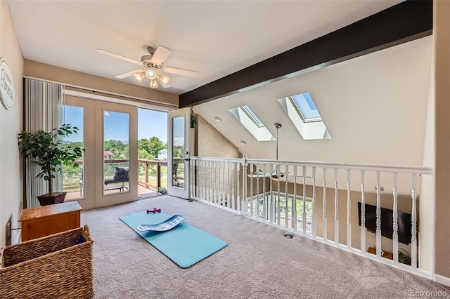 9733 Quay Loop, Broomfield, CO 80021 - unfurnished room featuring a ceiling fan, carpet flooring, a skylight, and beam ceiling
