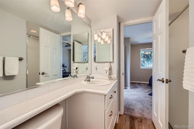 9733 Quay Loop, Broomfield, CO 80021 - bathroom with wood finished floors and vanity