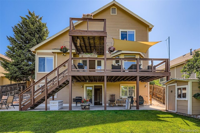 9733 Quay Loop, Broomfield, CO 80021 - back of property featuring a patio area, a balcony, and a storage shed