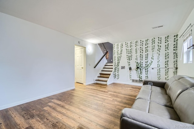 unfurnished living room featuring light wood-type flooring