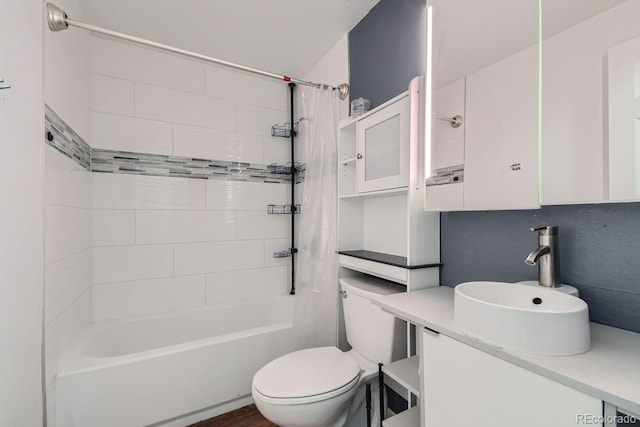 full bathroom featuring toilet, vanity, and shower / bath combo with shower curtain