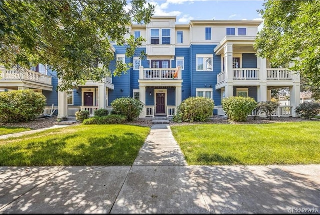 9484 E 108th Ave, Commerce City, CO 80640 - townhome / multi-family property featuring a front lawn
