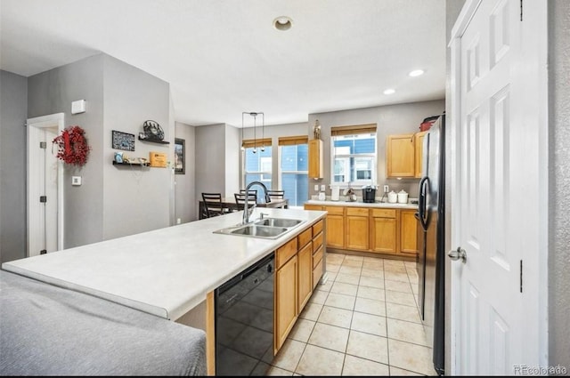 9484 E 108th Ave, Commerce City, CO 80640 - kitchen with black appliances, light countertops, a center island with sink, light tile patterned floors, and recessed lighting
