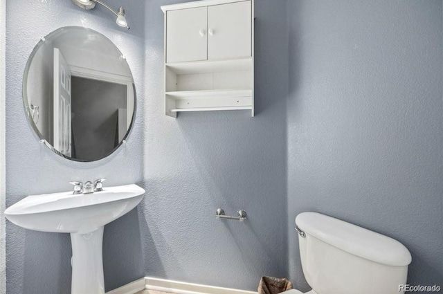9484 E 108th Ave, Commerce City, CO 80640 - half bath featuring toilet and a textured wall