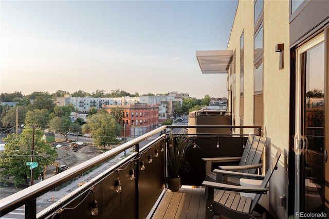 view of balcony at dusk