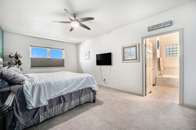 1155 S Balsam St, Lakewood, CO 80232 - carpeted bedroom featuring a ceiling fan, baseboards, and ensuite bath