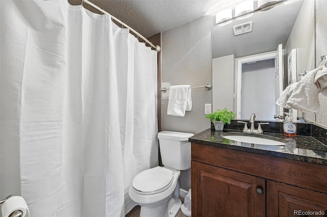 3047 W 47th Ave Unit 112, Denver, CO 80211 - full bath featuring a textured wall, a textured ceiling, toilet, and vanity