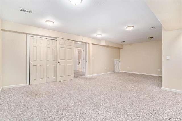 finished below grade area featuring carpet floors and baseboards