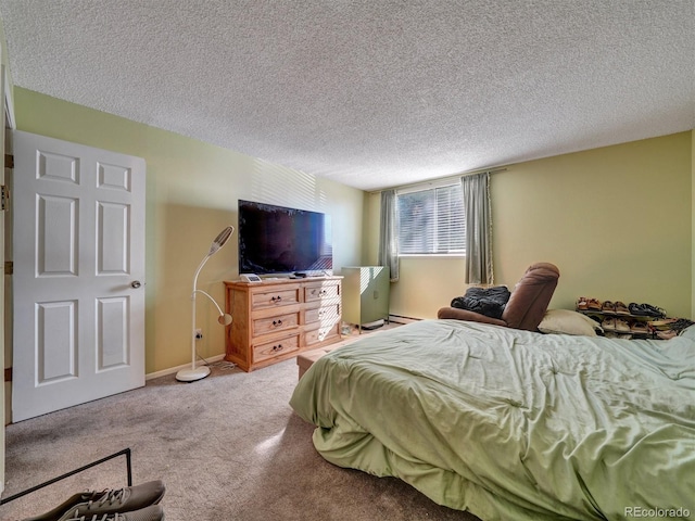 17505 E Mansfield Ave Unit 1411L, Aurora, CO 80013 - carpeted bedroom with a textured ceiling and a baseboard radiator
