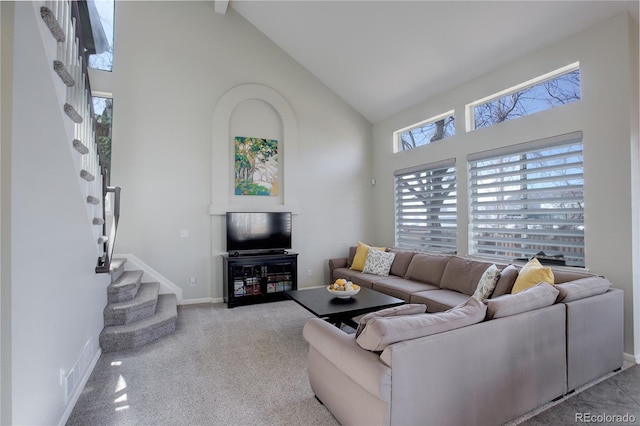 living room with stairway, carpet, baseboards, visible vents, and high vaulted ceiling