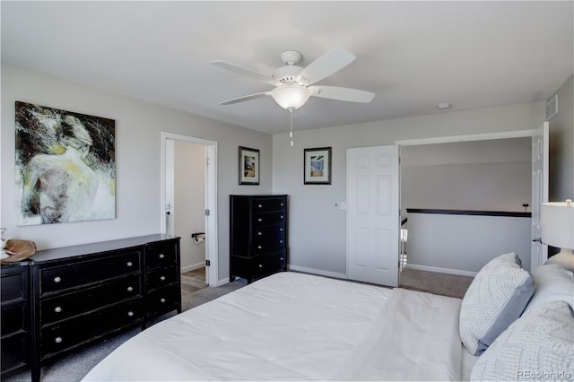 bedroom featuring carpet flooring, baseboards, visible vents, and a ceiling fan