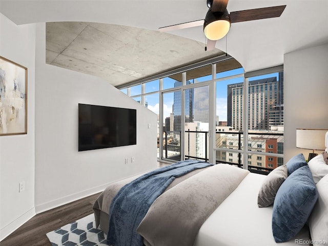 bedroom featuring access to outside, baseboards, a ceiling fan, and wood finished floors