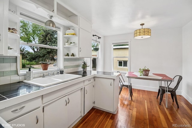 113 S 4th Ave, Brighton, CO 80601 - kitchen with open shelves, a sink, white cabinetry, and plenty of natural light