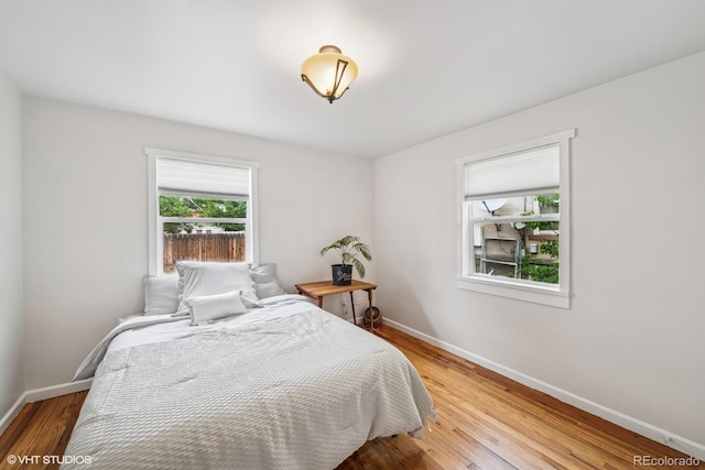 113 S 4th Ave, Brighton, CO 80601 - bedroom featuring baseboards and light wood-style floors