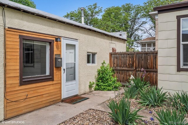 113 S 4th Ave, Brighton, CO 80601 - view of exterior entry featuring stucco siding