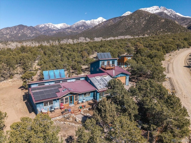 birds eye view of property featuring a mountain view and a forest view