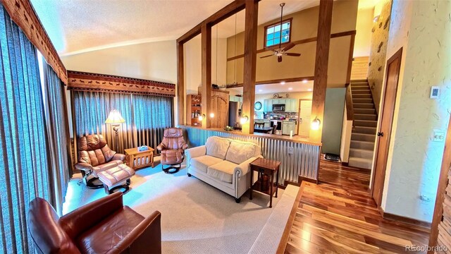 96 Mountainside Unit B-8, Granby, CO 80446 - common area with stairway, high vaulted ceiling, and a textured ceiling