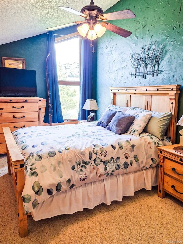 96 Mountainside Unit B-8, Granby, CO 80446 - carpeted bedroom with a textured ceiling and a ceiling fan