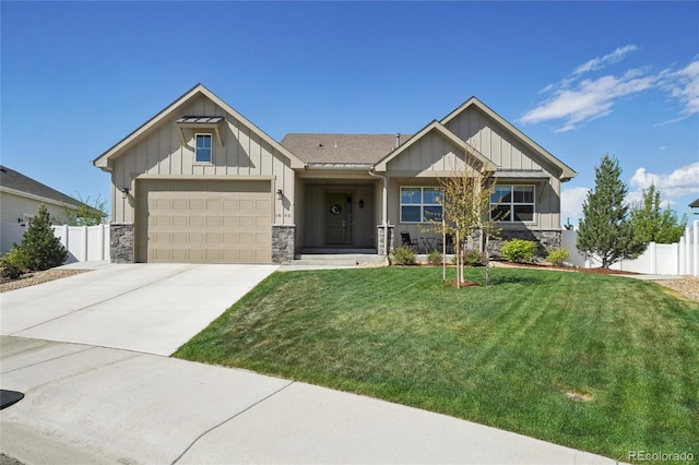 craftsman inspired home with a garage, fence, stone siding, board and batten siding, and concrete driveway