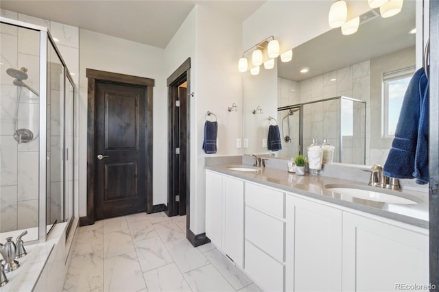 bathroom with double vanity, a sink, marble finish floor, and a stall shower