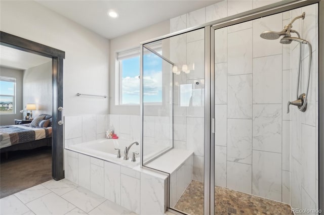 ensuite bathroom with a garden tub, marble finish floor, ensuite bathroom, recessed lighting, and a stall shower