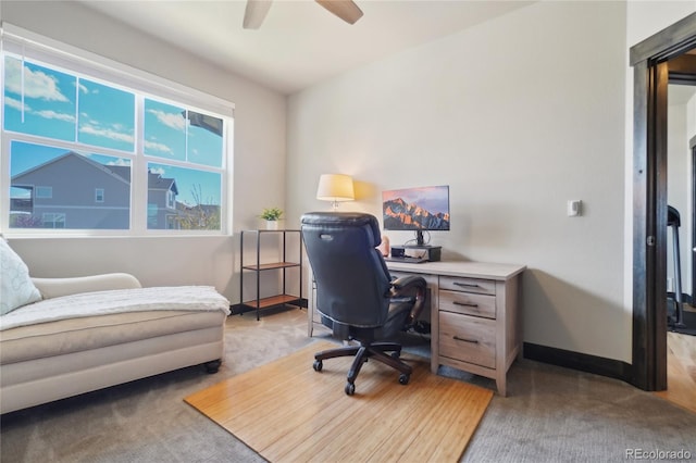 office area with baseboards and a ceiling fan