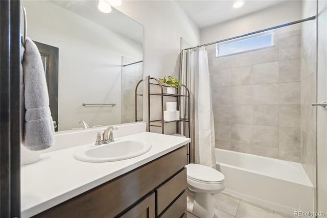 full bathroom featuring toilet, shower / bath combo with shower curtain, tile patterned flooring, and vanity