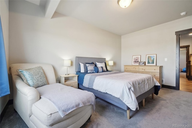 bedroom with baseboards and carpet floors