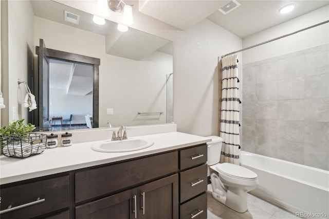 bathroom with toilet, visible vents, tile patterned flooring, and vanity