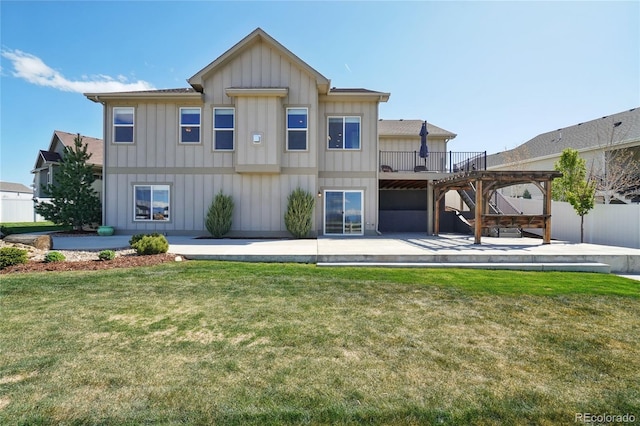 view of front of home with a wooden deck, fence, stairs, board and batten siding, and a patio area
