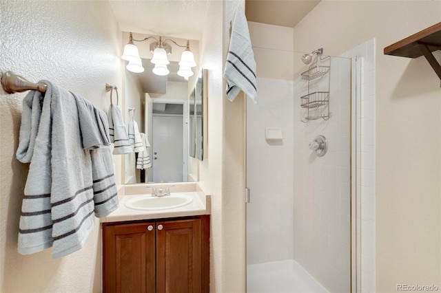 bathroom with vanity and an enclosed shower