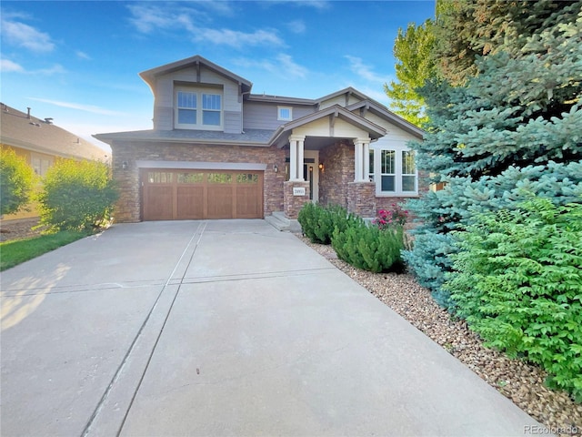 24955 E Roxbury Pl, Aurora, CO 80016 - craftsman-style home with a garage, driveway, and stone siding